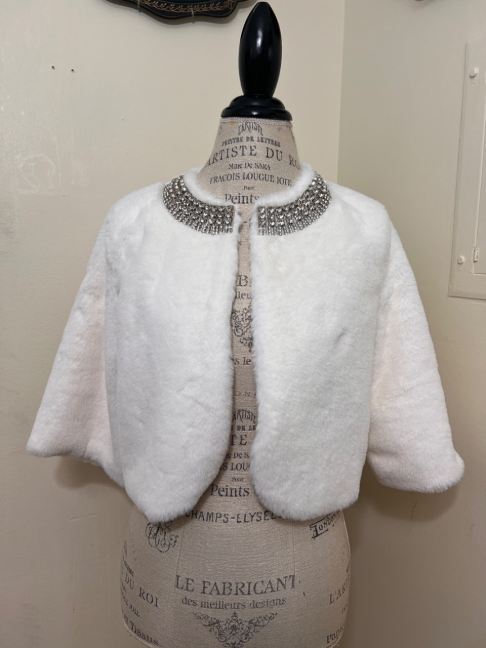 White faux-fur bolero jacket by Haani w/sparkling rhinestone-embellished collar